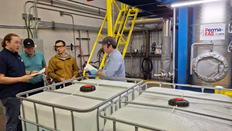 Industrial remediation facility with treatment tanks and processing equipment