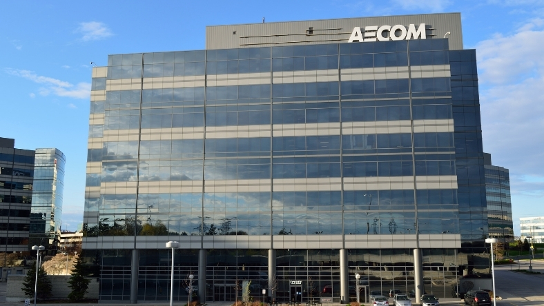Glass-fronted AECOM corporate building with exterior logo signage