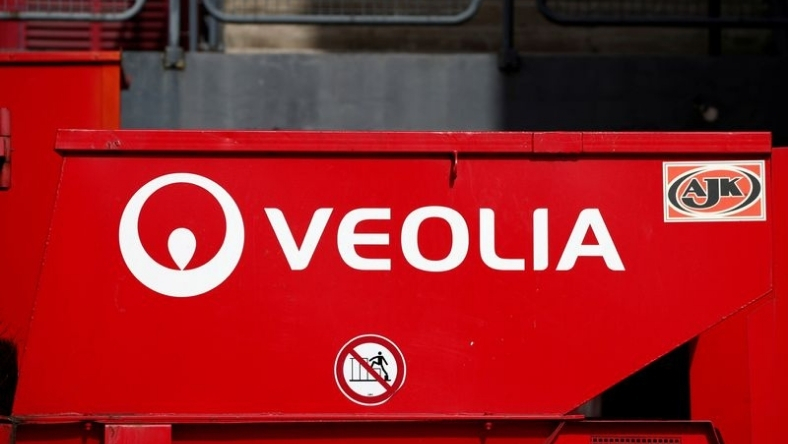 Veolia logo on red industrial vehicle panel